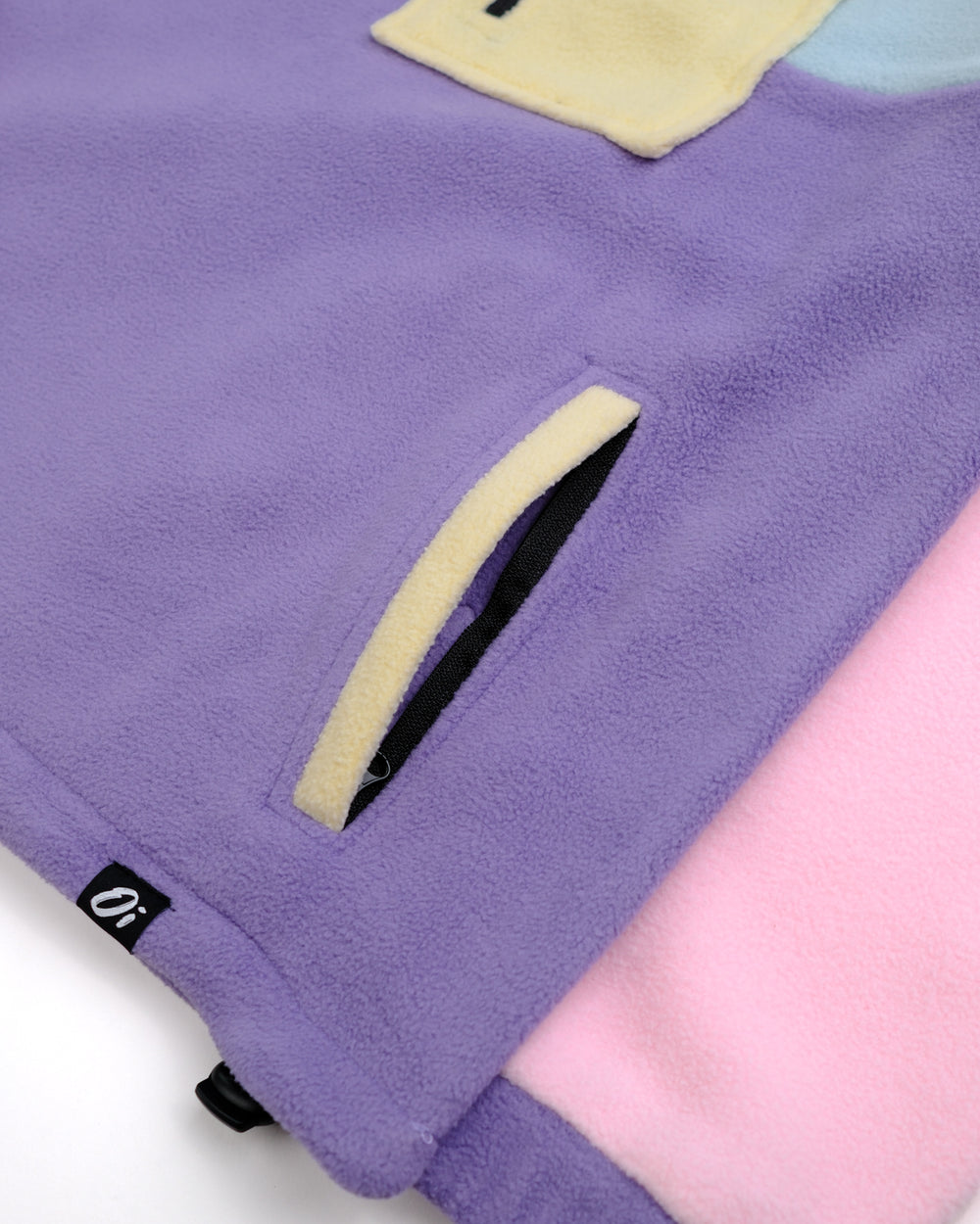 Close-up of a Petal Bloom fleece 1/2 zip on a white background