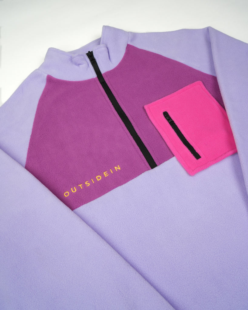 Unisex pink purple fleece with quarter zip, front pocket and toggle detail