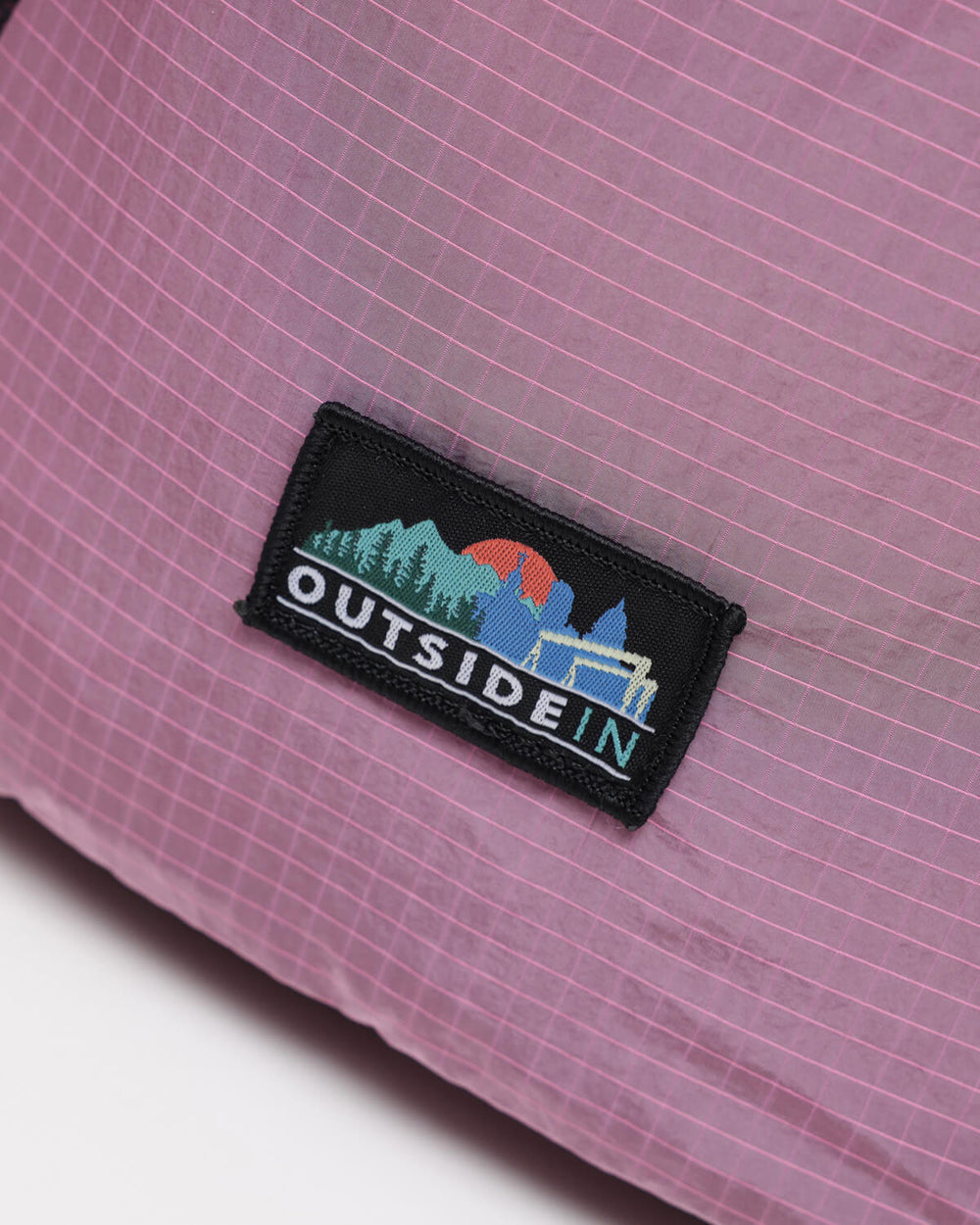 Close up of OutsideIn Pink Black Drawstring Daypack