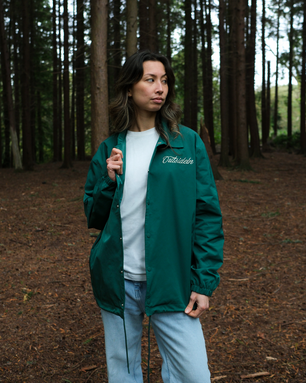 Model wearing Outside In Pine coach jacket, lifestyle image