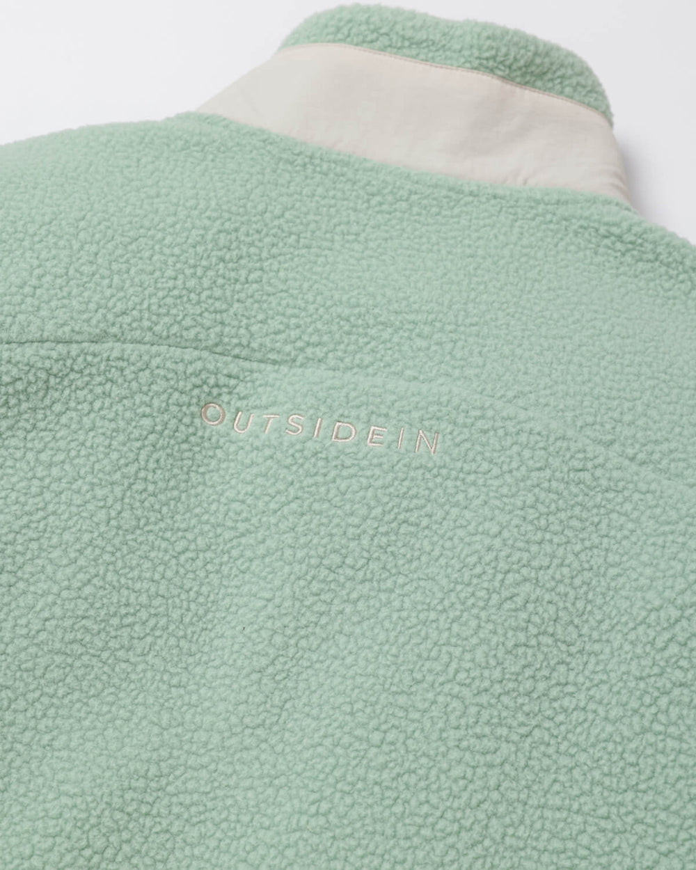 OUTSIDEIN logo embroidery on sage green borg fleece
