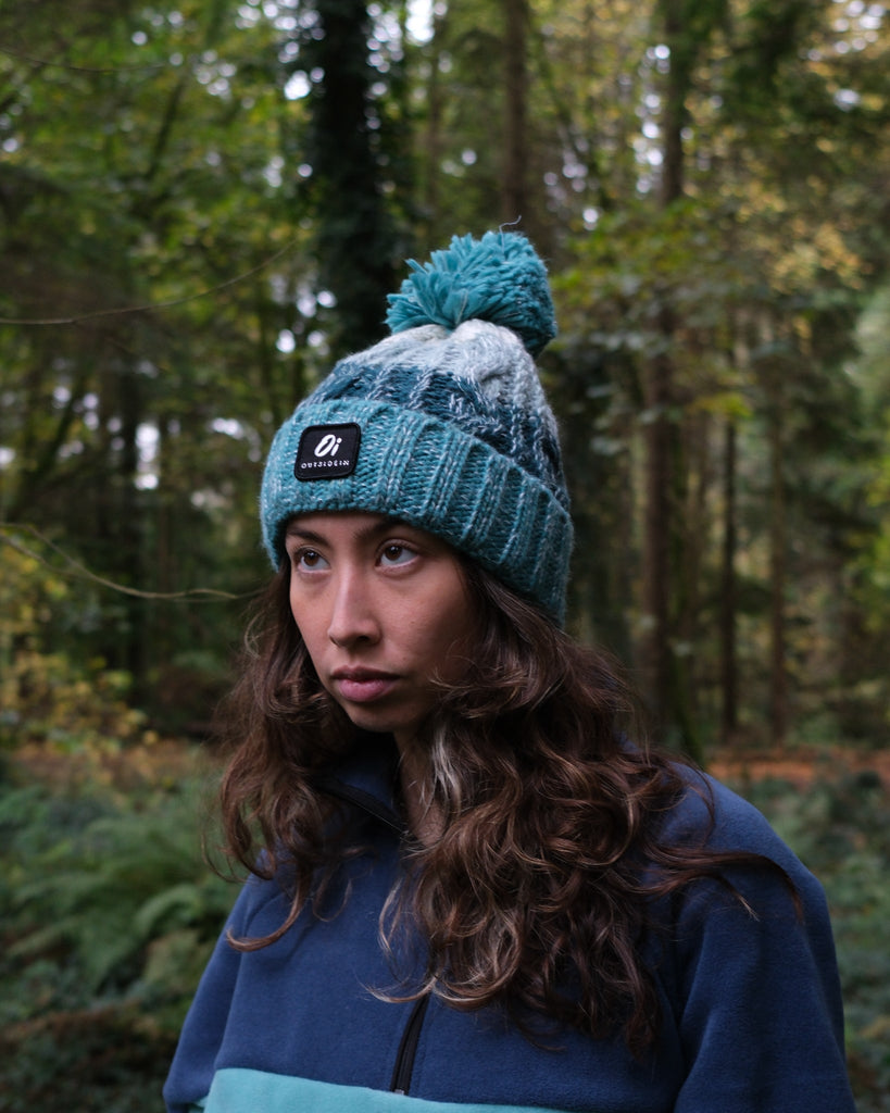 Sea Foam Pom hat with partial faux shearling lining and acrylic knit