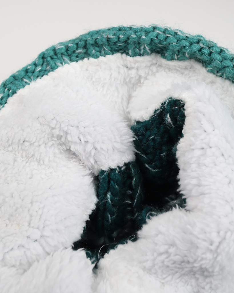 Sea Foam Pom hat with partial faux shearling lining and acrylic knit