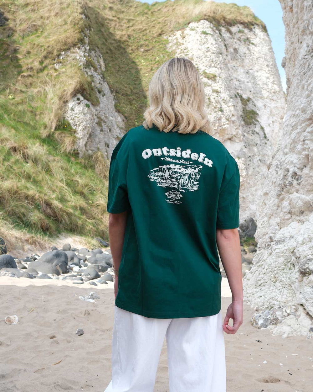Model wearing OutsideIn Pine Green Whiterocks t-shirt