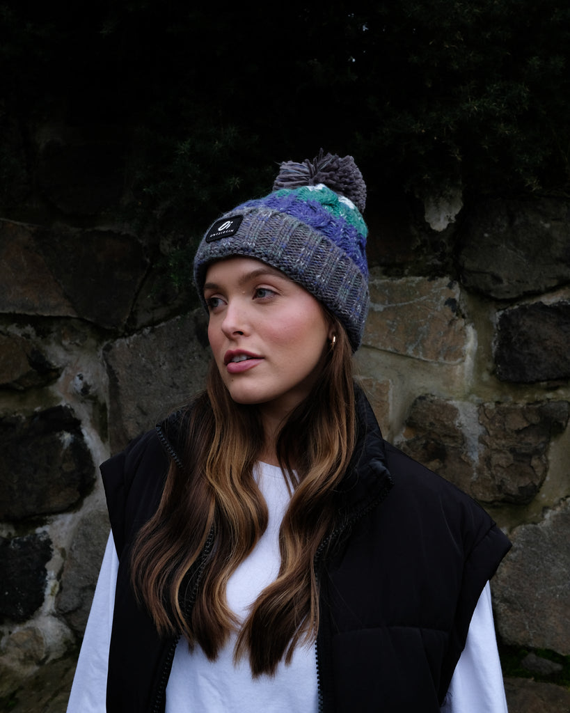 Pom hat in Wild Atlantic colour featuring soft faux shearling base lining and 100% acrylic yarn