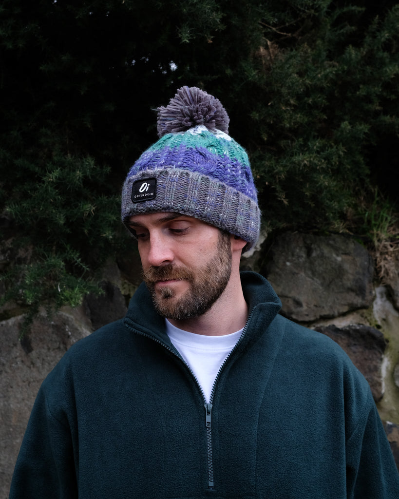 Pom hat in Wild Atlantic colour featuring soft faux shearling base lining and 100% acrylic yarn