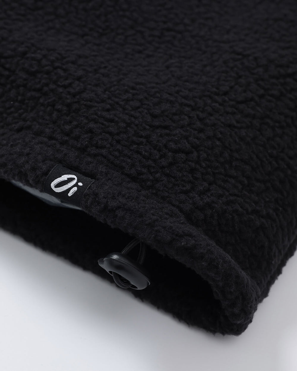 Close up of OutsideIn black essential fleece zipper.